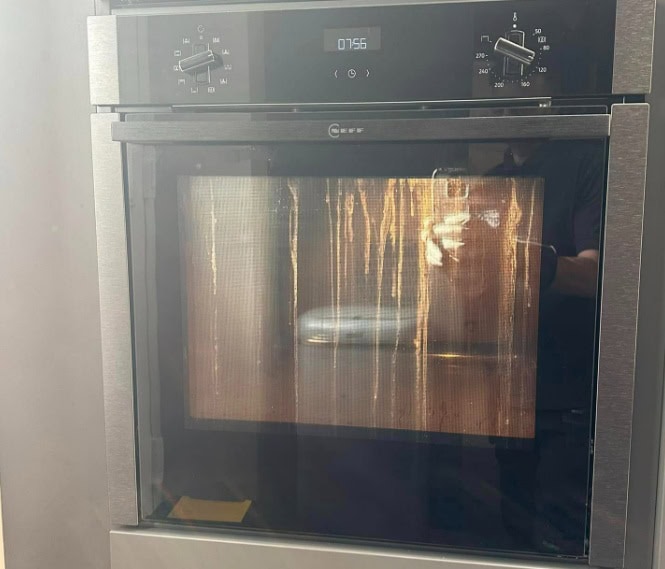 neff oven cleaning function 2 grease trapped between Neff oven door glass panels