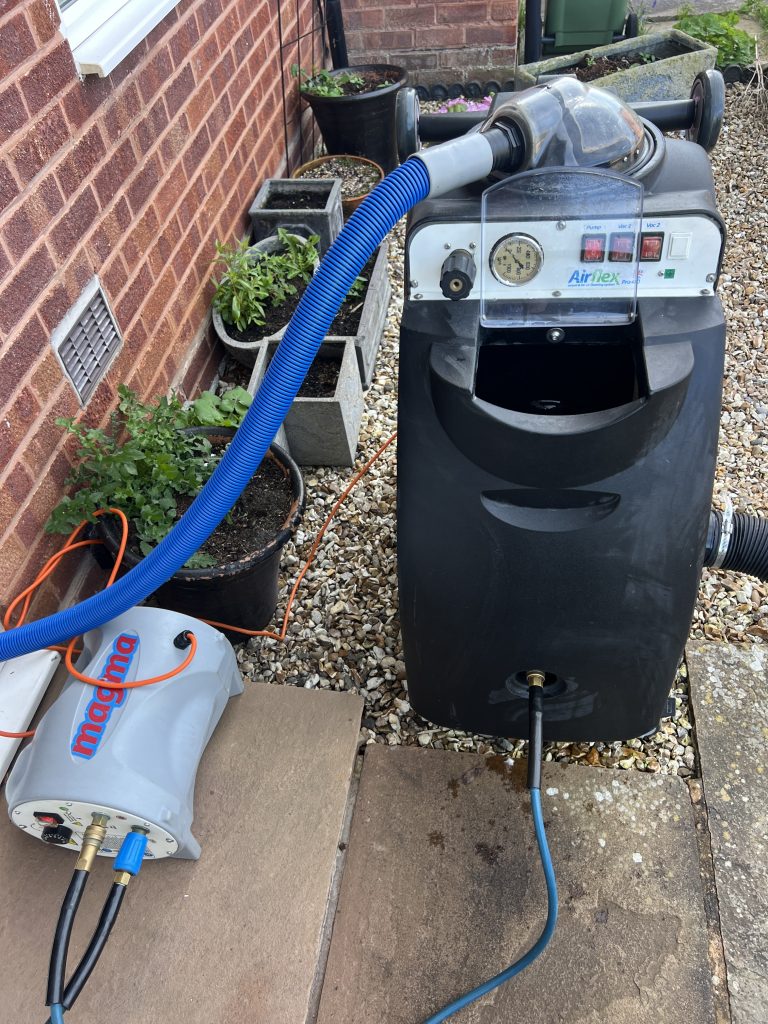 carpet-cleaning-without-chemicals-baby-safe-steam-cleaning 1 Professional carpet cleaning machine setup for steam cleaning without chemicals outside a UK