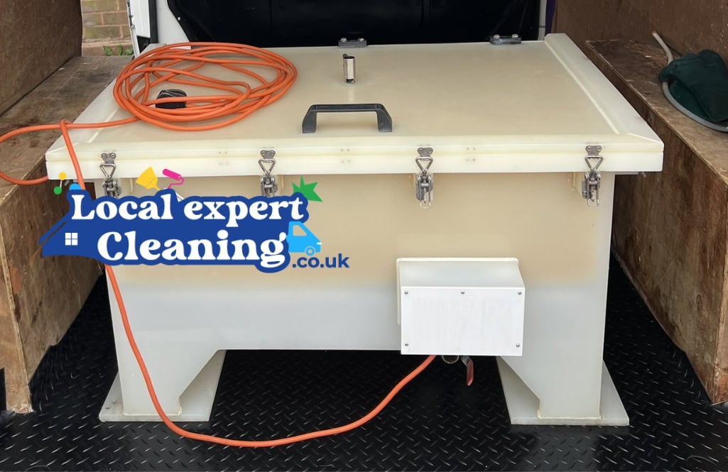 Heated dip tank used to clean removable oven parts during professional oven cleaning