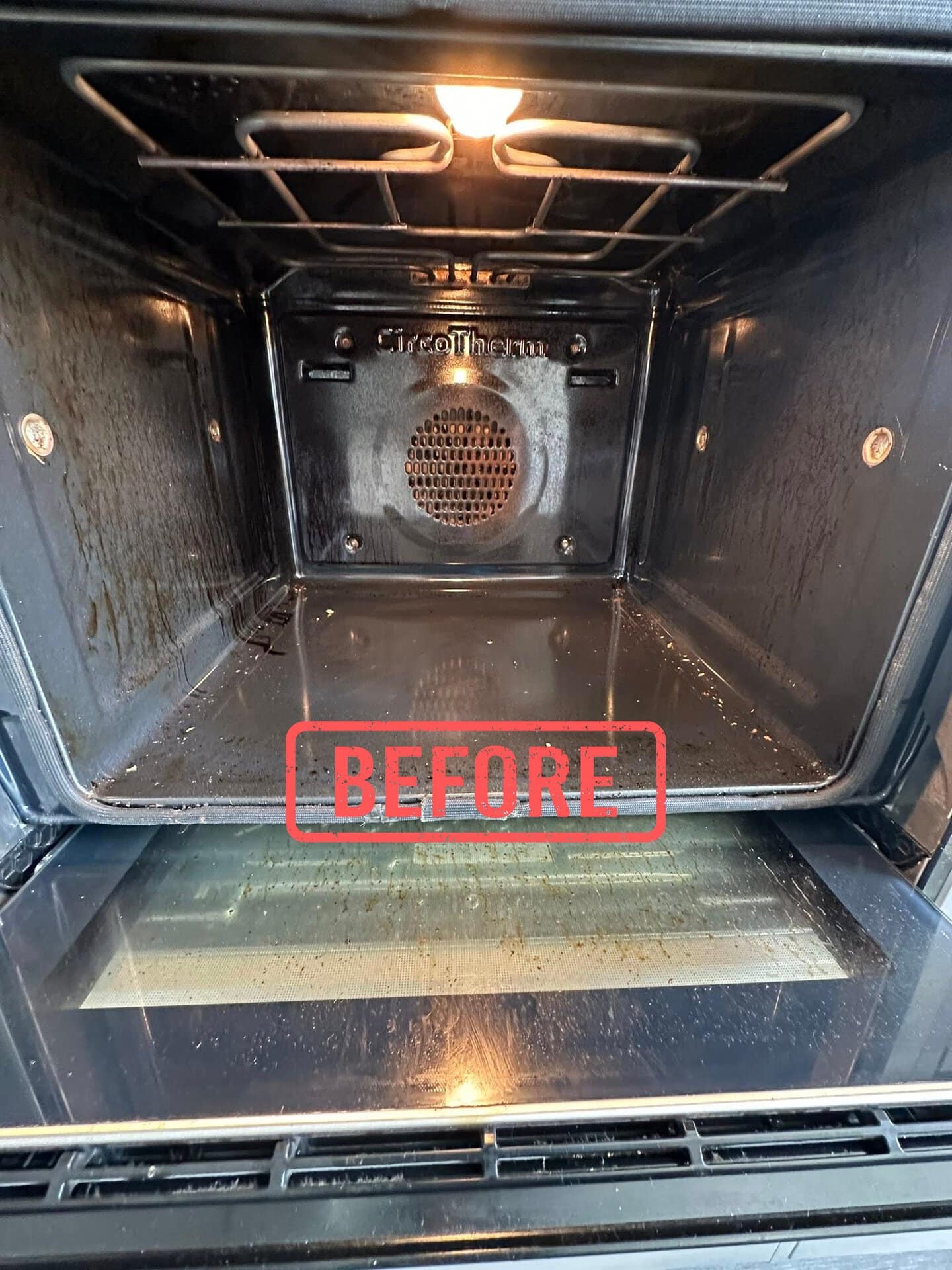 oven cleaning Tipton 4 Before professional oven cleaning in Tipton showing grease and baked-on residue inside the oven