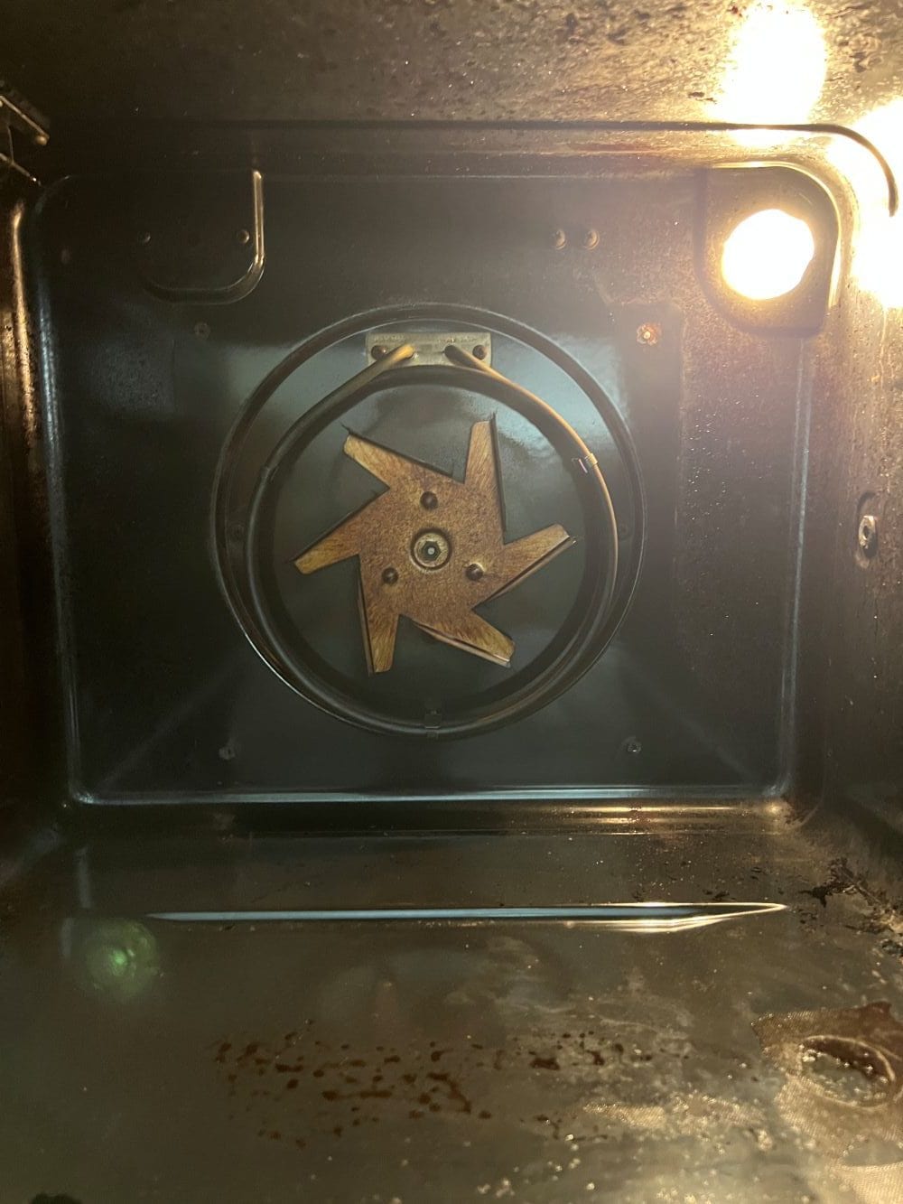 Oven Cleaning Wolverhampton 8 Oven fan blade before cleaning in Wolverhampton showing grease inside the fan area