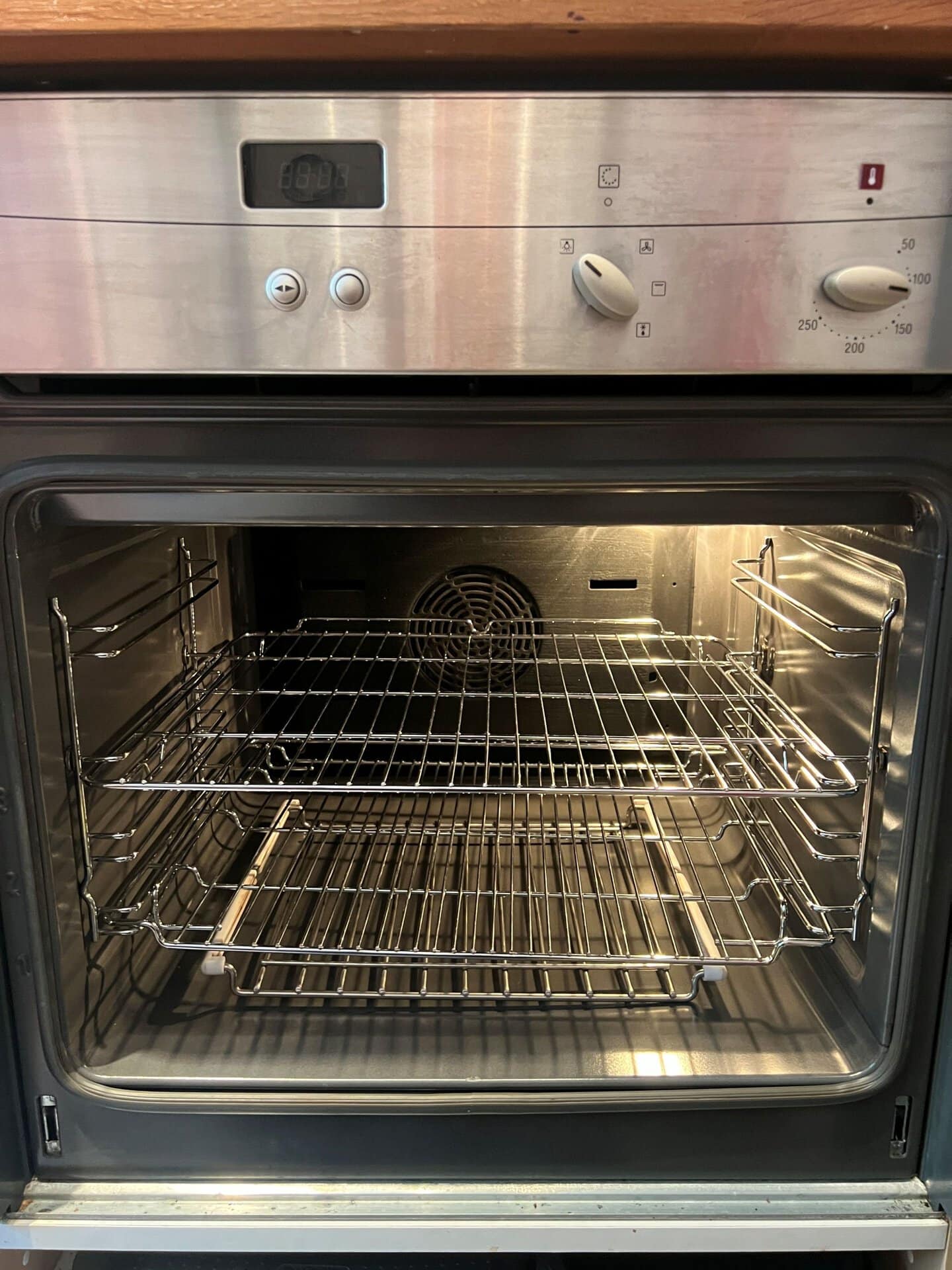 Clean oven interior in Alvechurch with the backplate, side supports and racks refitted