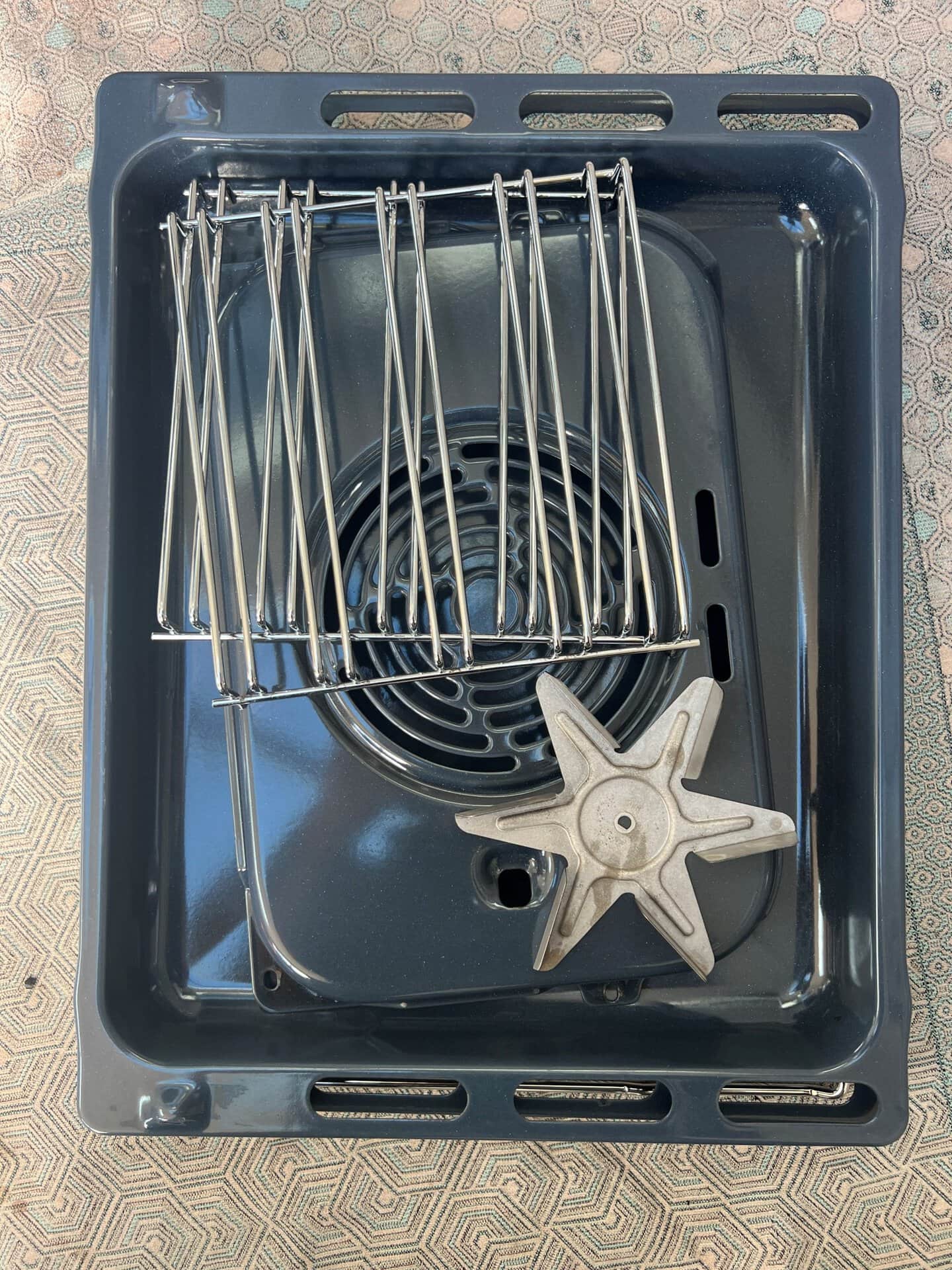 Clean oven racks, trays, back plate and fan blade after oven cleaning in West Bromwich